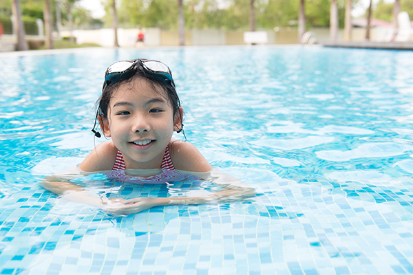swim tips 2584 - Asian teen girl in swimming pool looking at camera