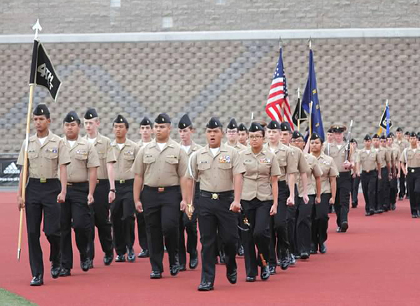 The Navy Junior Reserve Officer Training Corps doing marching drills.