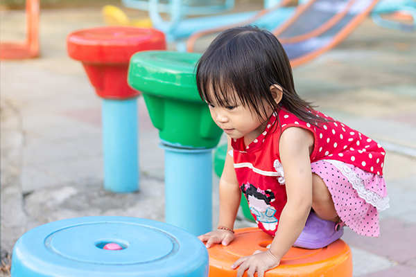 happy asian child girl playing and climbing 2441