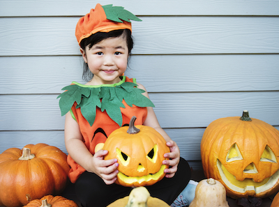 little kid with halloween pumpkin 2022 12 15 23 28 53 utc
