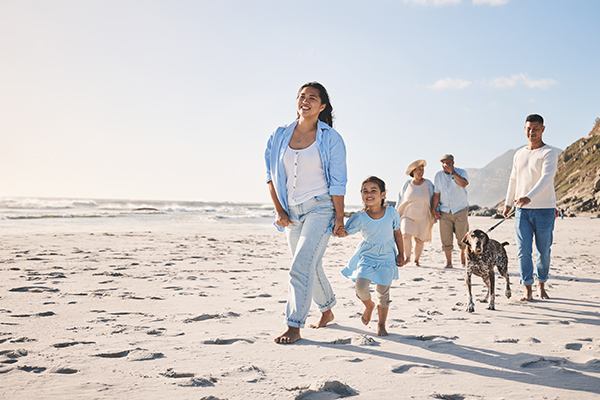 Family, beach and walking outdoor with a dog in summer for fun, freedom and vacation. People, child.