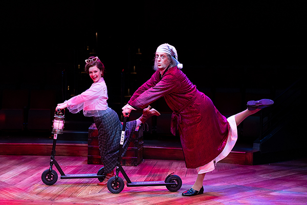 Cathryn Wake as Ghost of Christmas Present and Christopher Sieber as Ebenezer Scrooge in Ebenezer Scrooge’s BIG San Diego Christmas Show, 2023. Photo by Rich Soublet II.