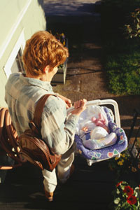 Use two hands to carry an infant carrier