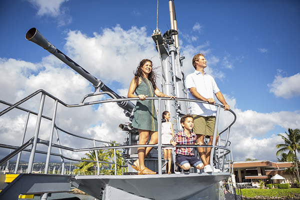 Folks like to stand next to the big gun at USS Bowfin Submarine Museum at Pearl Harbor
