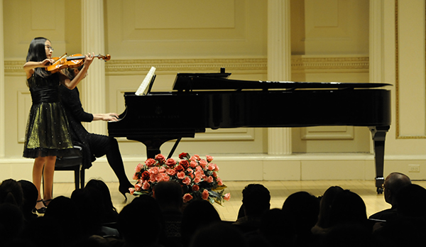 Susan performs on her violin.