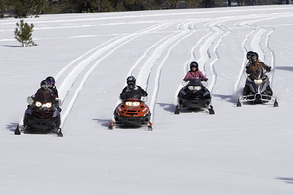 Snowmobiles race down the slopes of Mammoth.